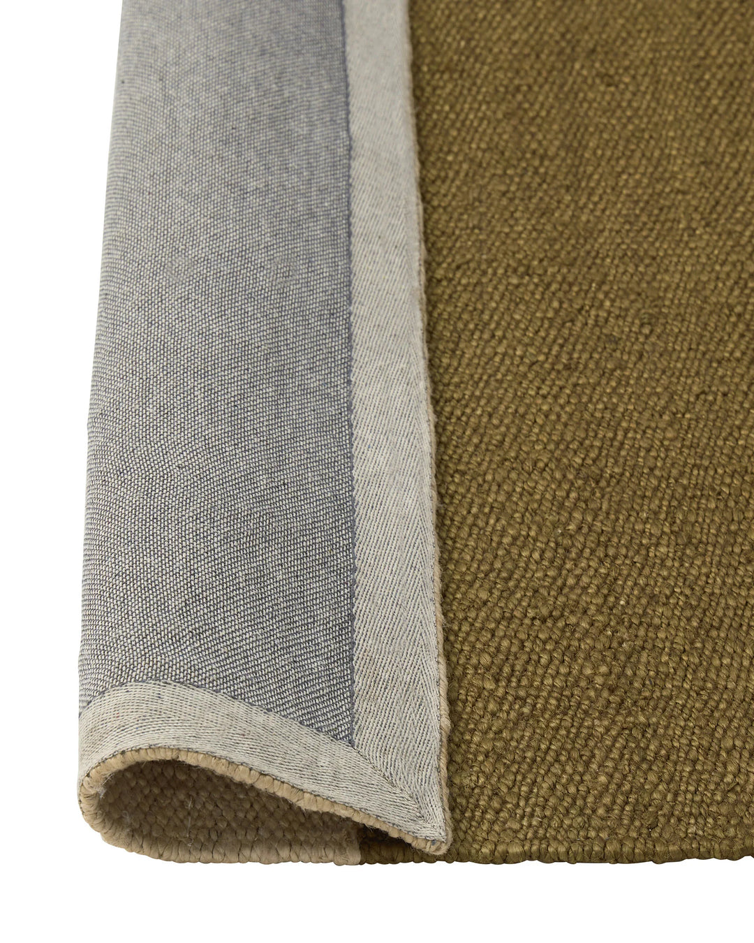 Ruben Terra rug detail, hand-woven jute in olive and charcoal with natural edge binding by Weave Home