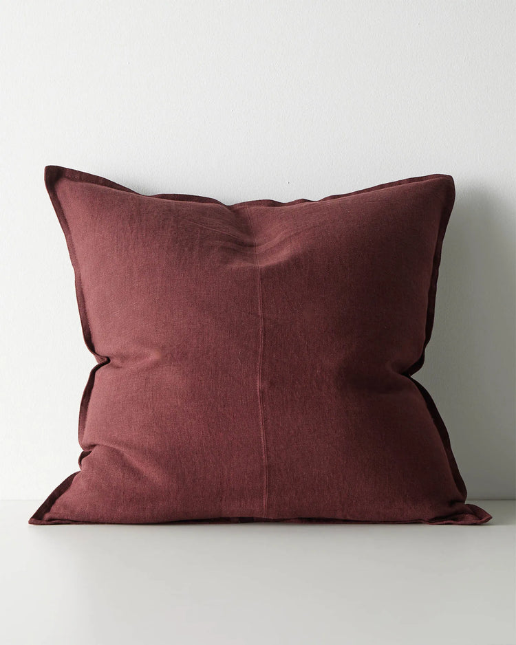Como Garnet 60x60 linen cushion cover in deep burgundy, front view, with tailored piping edge by Weave Home