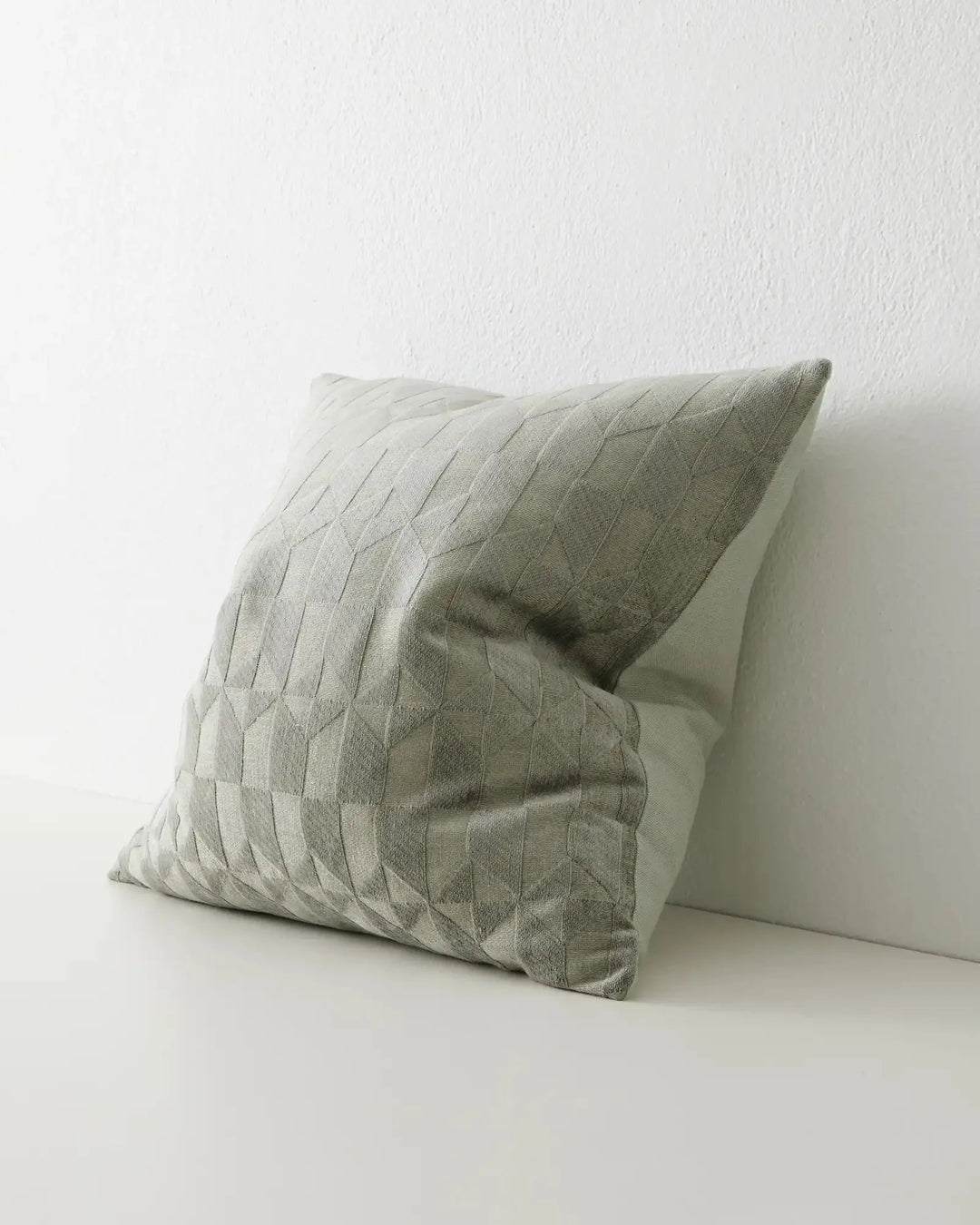 Marina Laurel cushion side view, 50x50cm sage green viscose blend with geometric quilted pattern, by Weave Home