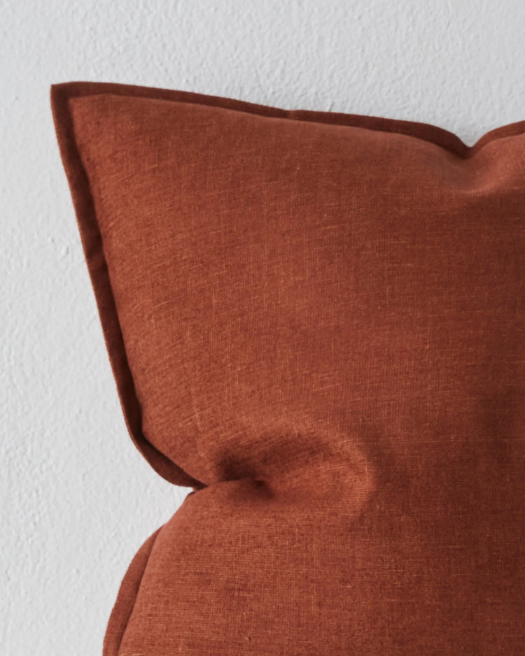 Fiore Rosewood linen viscose blend cushion close-up, showing rich maroon-red fabric with soft luminous sheen and piped edge detail by Weave Home