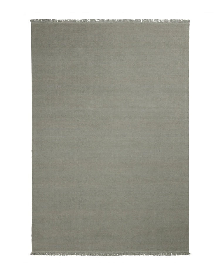 Emilio Flint linen rug in soft grey-blue, flat-weave construction with fringe border detail by Weave Home