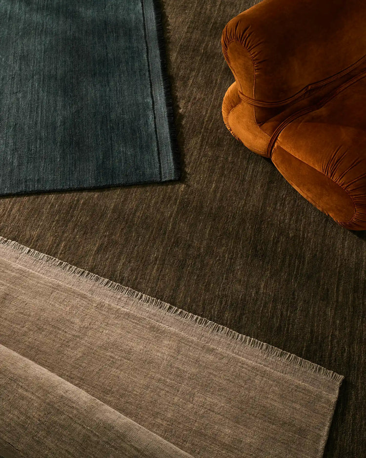 Silvio Dovecote rug in earthy brown with micro fringe border and tonal texture, styled overhead view by Weave Home