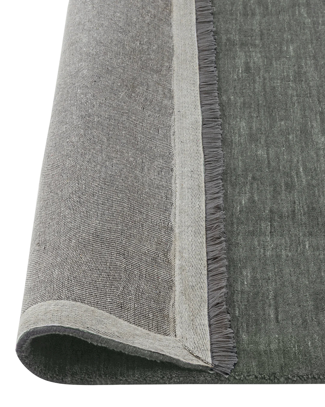 Silvio Fog rug detail view, deep grey with blue undertones, showing micro fringe border and textured weave by Weave Home