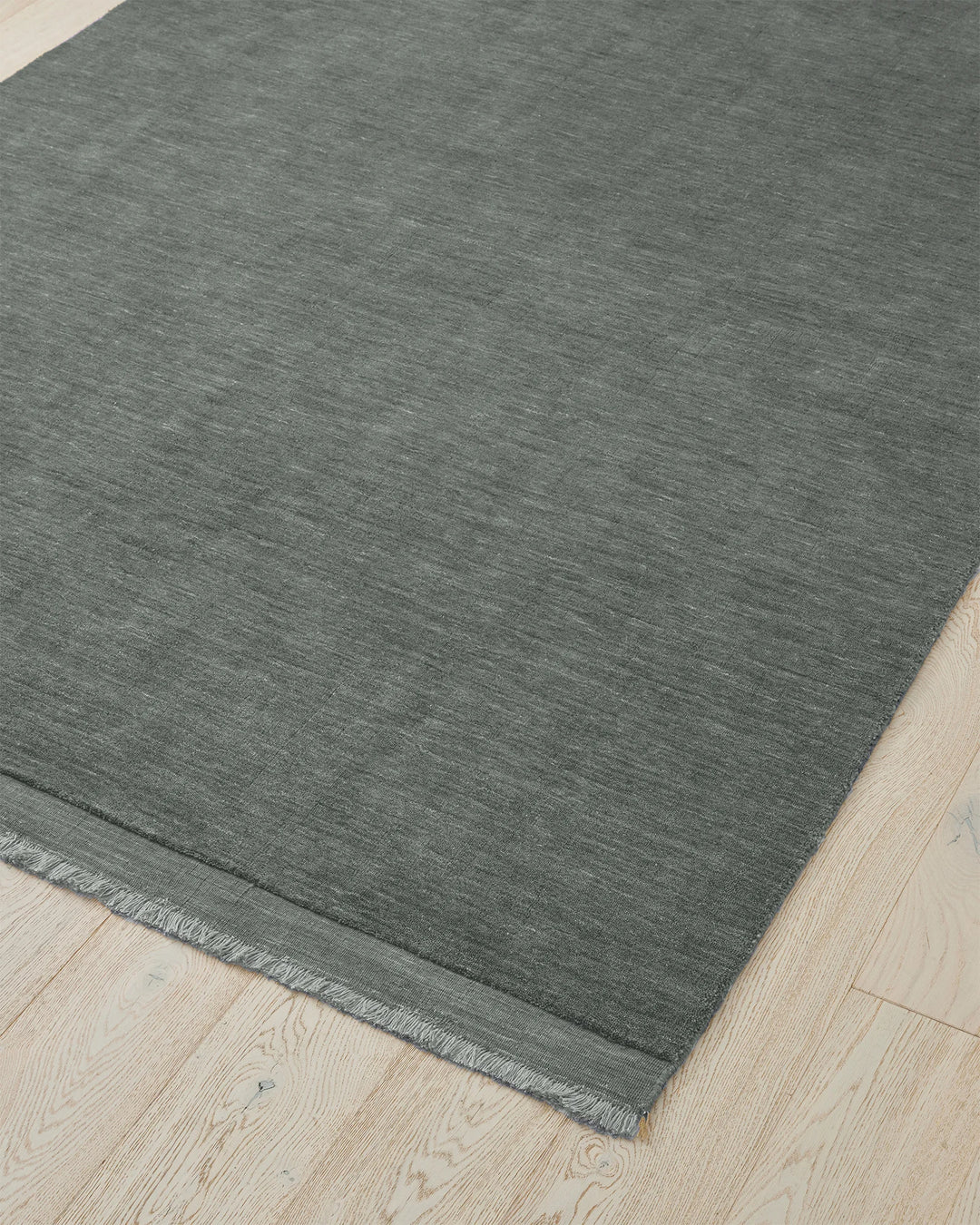 Silvio Fog rug, 3m x 4m, deep grey with blue undertones, micro fringe border detail, by Weave Home