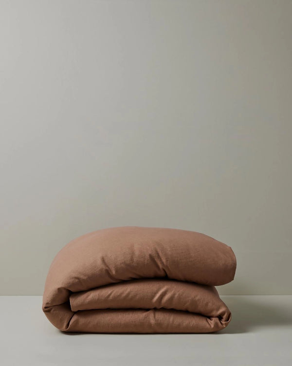 Ravello Quilt Cover in Biscuit, French Flax Linen, folded to show soft prewashed texture by Weave Home