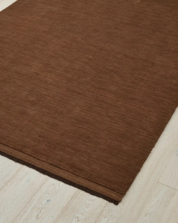 Silvio Sienna hand-woven rug in reddish-brown with micro fringe border detail, 3m x 4m, by Weave Home