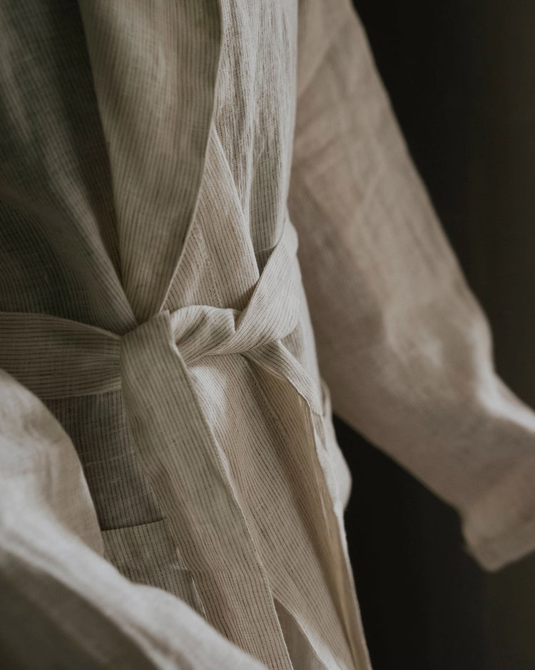 Sova Robe Savanna detail, pinstriped European linen wrap with tie closure in cream, by Weave Home